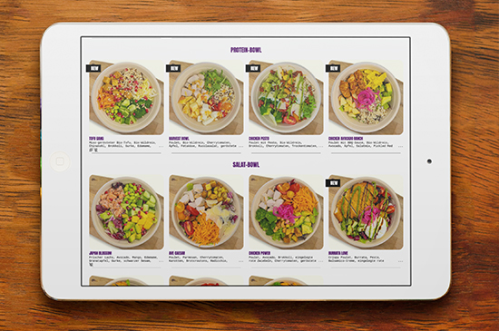 Wild Garden Menü mit gesunden Poke Bowls und Salaten auf dem Tablet